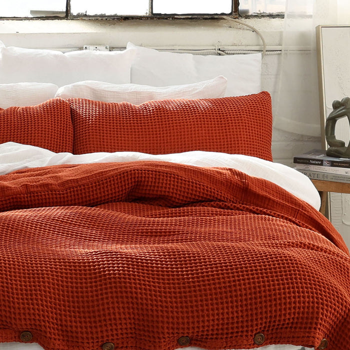 Organic cotton duvet cover styled on a light, serene bed — breathable, soft, and naturally elegant.